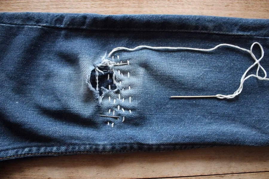How do you stitch on jeans?